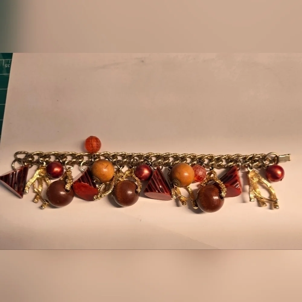 Bakelite gold tone charm bracelet